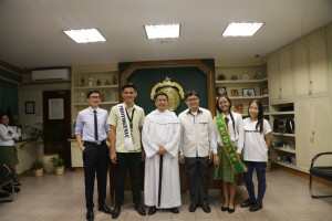 Eddie Lloyd Gimena (white sash) and Kharl Marie Tan (green sash) pay a courtesy vicit to University President Cristopher Maspara after bagging awards at the Mr. and Miss CF Accountancy 2018.